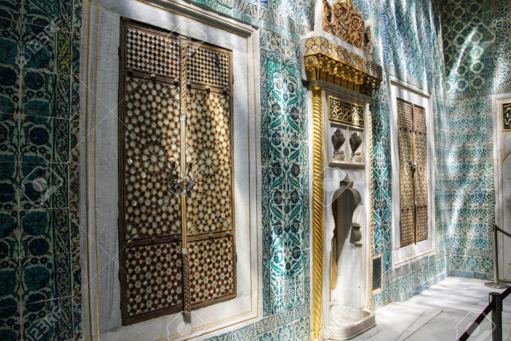 Inlaid doors and mosaic tiles in dappled shadows in the Harem in Topkapi Palace, in Istanbul, Turkey